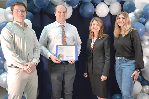Aaron Bossen receiving the  Coppola Graduate Student Award for Student Service and Leadership
