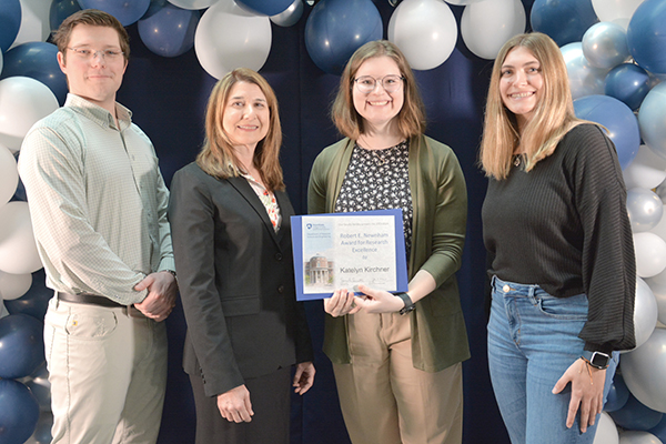 Katelyn Kirchner receiving Robert E. Newnham Award for Research Excellence