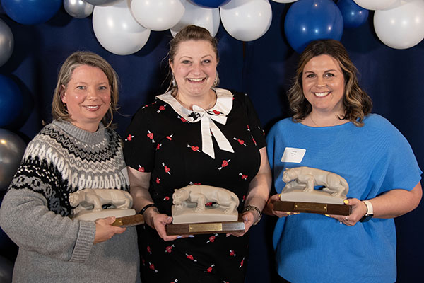 Sue Hyde, Meg Abplanalp, and Hayley Barnes receive the MatSE Staff Excellence Award