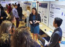 Rachel Bruning, center, explains her research during the 2018 Undergraduate Exhibition. Image: Steve Tressler